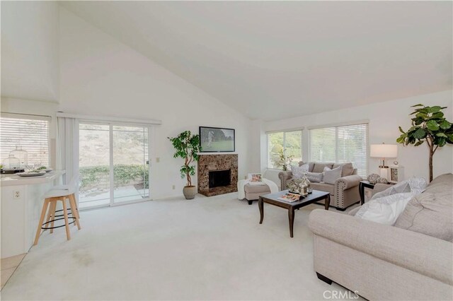 2501 Tiffany Pl, Fullerton, CA 92833 - carpeted living room featuring healthy amount of natural light, a premium fireplace, and high vaulted ceiling