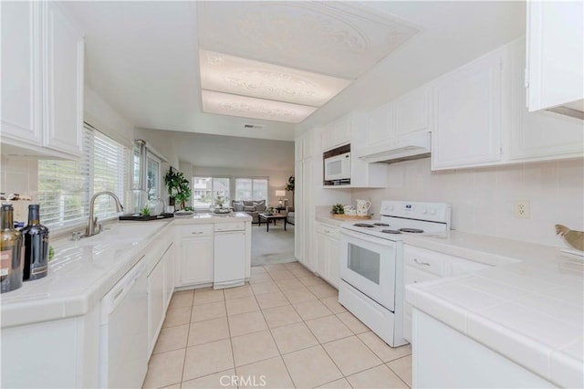 2501 Tiffany Pl, Fullerton, CA 92833 - kitchen featuring white appliances, tile counters, a sink, and white cabinetry
