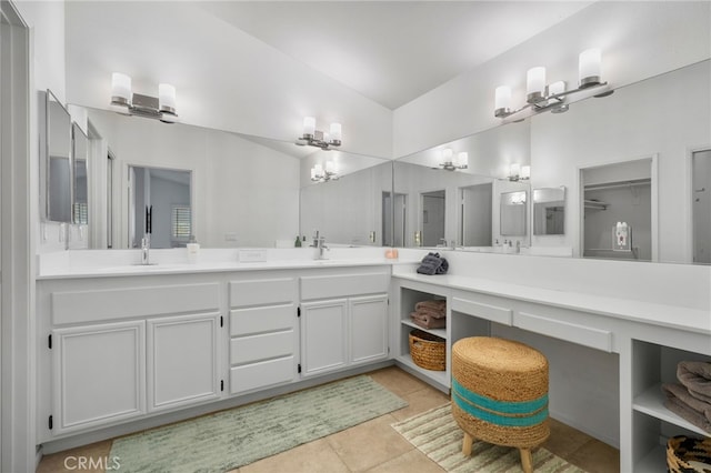 49239 Barrymore St, Indio, CA 92201 - bathroom with double vanity, tile patterned flooring, and vaulted ceiling