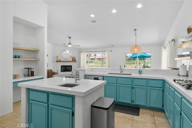 49239 Barrymore St, Indio, CA 92201 - kitchen with a sink, open shelves, appliances with stainless steel finishes, light countertops, and recessed lighting