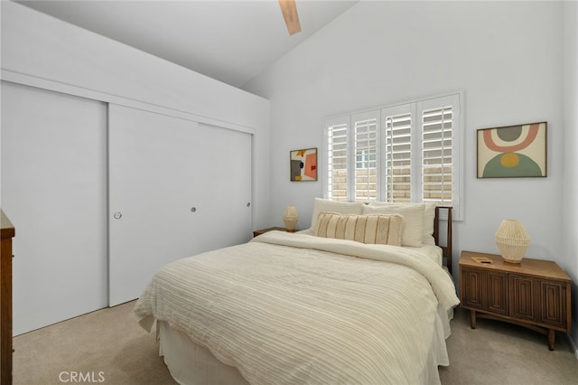 49239 Barrymore St, Indio, CA 92201 - bedroom with light carpet, a closet, high vaulted ceiling, and ceiling fan