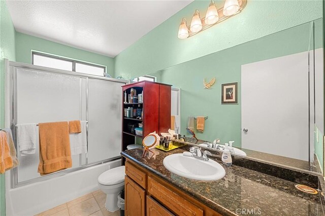 27525 Ventura Dr, Cathedral City, CA 92234 - bathroom featuring vanity, toilet, shower / bath combination with glass door, and tile patterned floors