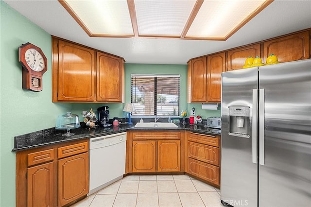 27525 Ventura Dr, Cathedral City, CA 92234 - kitchen featuring stainless steel fridge, dishwasher, a sink, and brown cabinetry
