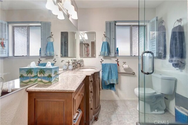 24812 Calle El Toro Grande, Lake Forest, CA 92630 - full bathroom featuring vanity, toilet, tile patterned floors, a chandelier, and a shower with shower door