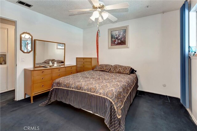 24812 Calle El Toro Grande, Lake Forest, CA 92630 - bedroom featuring dark colored carpet, a textured ceiling, and ceiling fan
