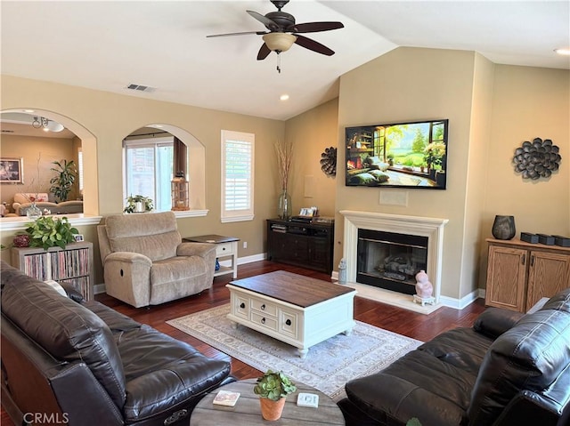 757 Onstott Rd, Lompoc, CA 93436 - living room featuring a ceiling fan, dark wood-style floors, arched walkways, vaulted ceiling, and baseboards
