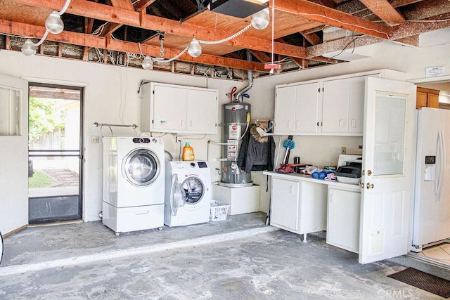 915 Moran Ct, Paso Robles, CA 93446 - washroom featuring separate washer and dryer, cabinet space, and strapped water heater