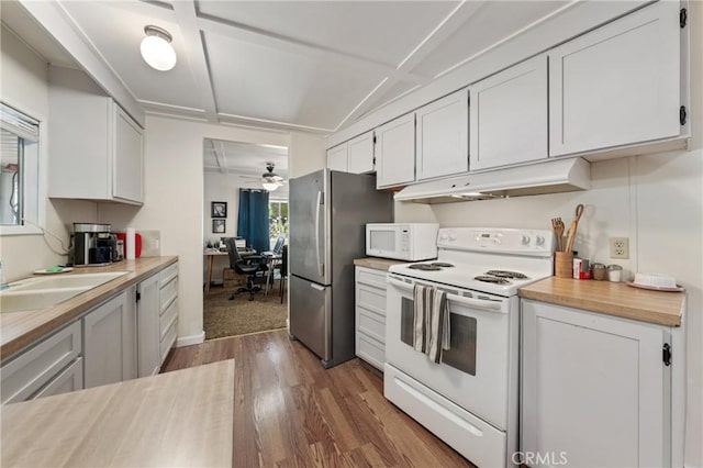 3265 14th St, Clearlake, CA 95422 - kitchen with white appliances, under cabinet range hood, dark wood-style flooring, a sink, and ceiling fan