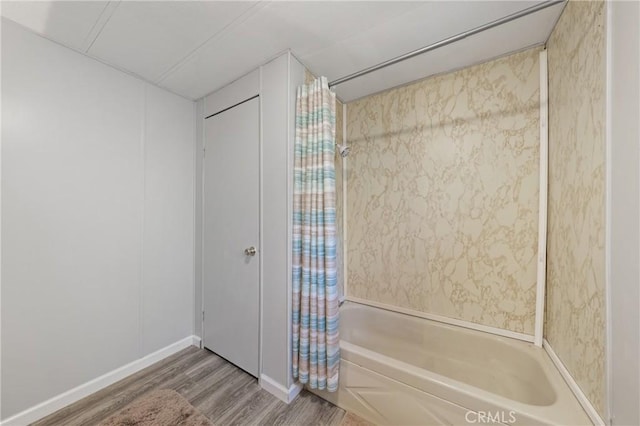 3265 14th St, Clearlake, CA 95422 - bathroom featuring wood finished floors, shower / bath combination with curtain, and baseboards