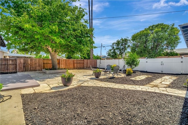 7741 Shoup Ave, West Hills, CA 91304 - fenced backyard with a patio area and a gate