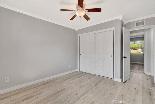 7741 Shoup Ave, West Hills, CA 91304 - unfurnished bedroom featuring crown molding, light wood-style floors, baseboards, a closet, and a ceiling fan
