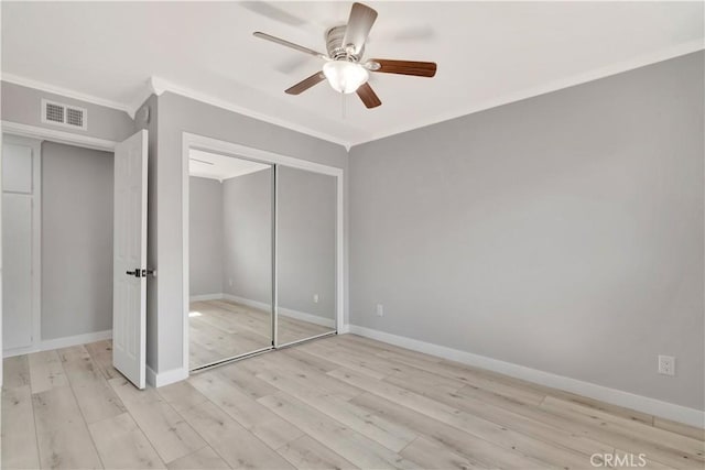 7741 Shoup Ave, West Hills, CA 91304 - unfurnished bedroom featuring light wood-style floors, crown molding, a closet, baseboards, and a ceiling fan