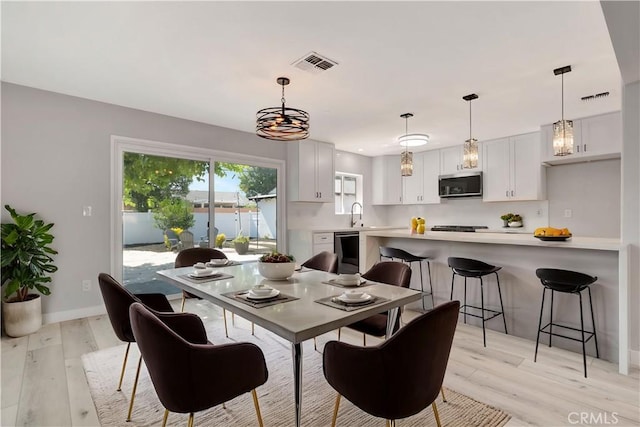 7741 Shoup Ave, West Hills, CA 91304 - dining area with light wood finished floors and baseboards