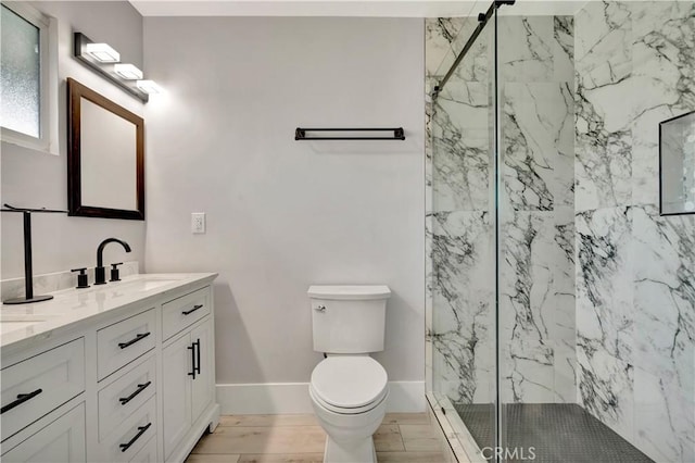 7741 Shoup Ave, West Hills, CA 91304 - bathroom with double vanity, a marble finish shower, toilet, and baseboards