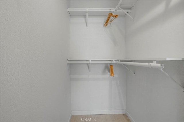 84260 Tramonto Way, Indio, CA 92203 - walk in closet featuring wood finished floors