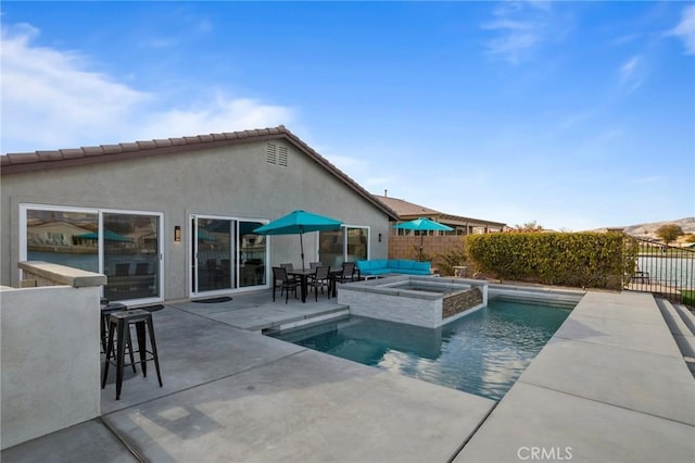 84260 Tramonto Way, Indio, CA 92203 - view of swimming pool featuring a fenced backyard, a patio, an outdoor living space, outdoor dining space, and exterior bar