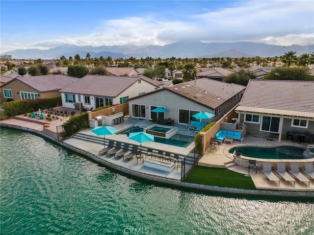 84260 Tramonto Way, Indio, CA 92203 - view of swimming pool featuring a residential view, a pool with connected hot tub, a patio area, and a mountain view