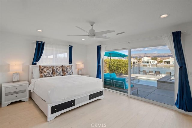 84260 Tramonto Way, Indio, CA 92203 - bedroom featuring access to outside, light wood-type flooring, multiple windows, and recessed lighting