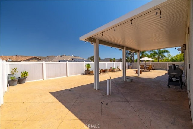 13946 Moqui Way, Corona, CA 92883 - fenced backyard featuring a patio and outdoor dining area