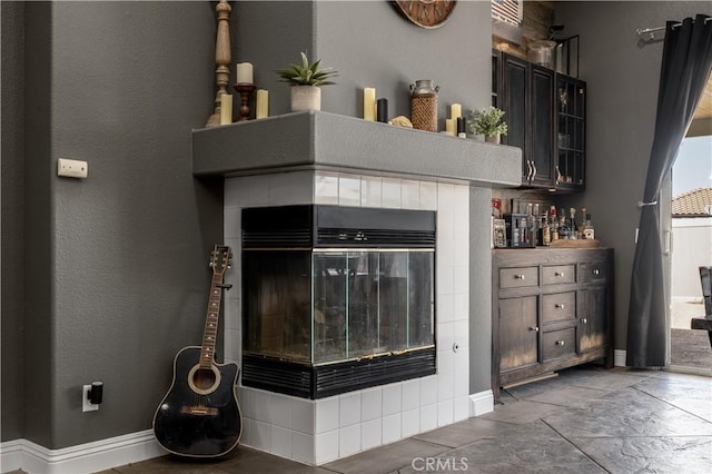 13946 Moqui Way, Corona, CA 92883 - detailed view of a tile fireplace and baseboards