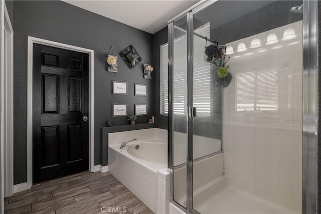 13946 Moqui Way, Corona, CA 92883 - bathroom featuring a stall shower, a garden tub, and wood finished floors