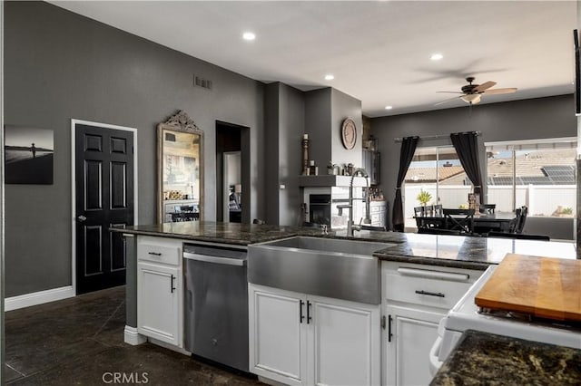 13946 Moqui Way, Corona, CA 92883 - kitchen with stainless steel dishwasher, a sink, ceiling fan, white cabinetry, and recessed lighting
