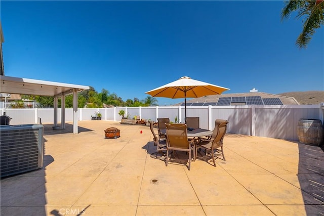 13946 Moqui Way, Corona, CA 92883 - fenced backyard featuring a patio area, a fire pit, and outdoor dining area