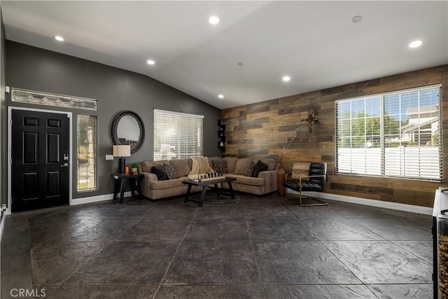 13946 Moqui Way, Corona, CA 92883 - living area featuring vaulted ceiling, baseboards, wooden walls, recessed lighting, and stone tile floors