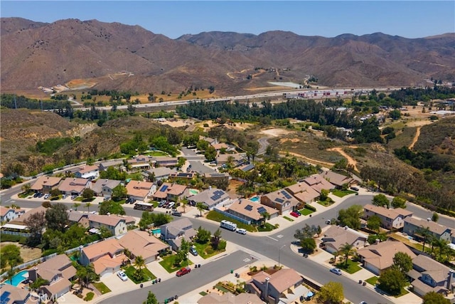 13946 Moqui Way, Corona, CA 92883 - aerial view of property and surrounding area with mountains and nearby suburban area