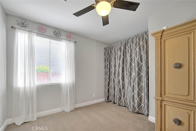 8758 Aspen Ct, Riverside, CA 92508 - empty room featuring light colored carpet, a ceiling fan, and baseboards