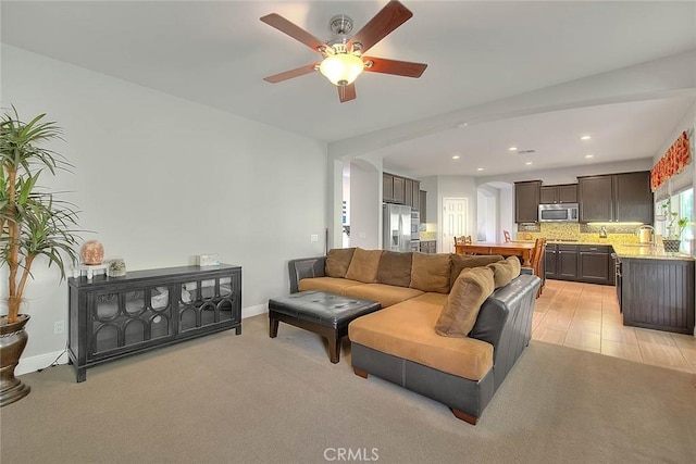 8758 Aspen Ct, Riverside, CA 92508 - living area featuring a ceiling fan, recessed lighting, arched walkways, and baseboards