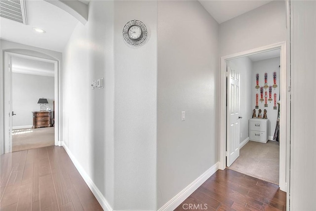 8758 Aspen Ct, Riverside, CA 92508 - hallway featuring dark wood-style floors, arched walkways, baseboards, and recessed lighting