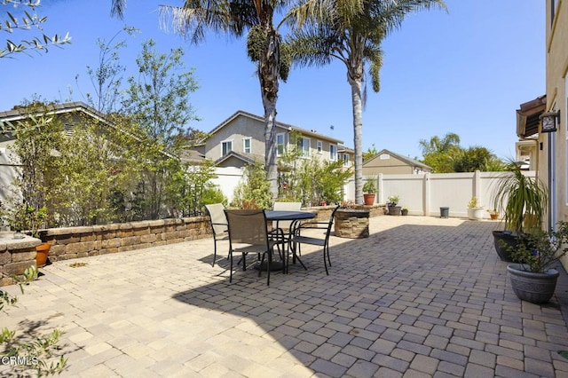 1269 Hacienda Dr, Oxnard, CA 93030 - fenced backyard featuring a patio, outdoor dining area, and a residential view