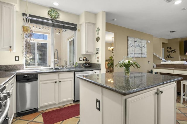 1269 Hacienda Dr, Oxnard, CA 93030 - kitchen with dishwasher, a sink, white cabinetry, a center island, and recessed lighting