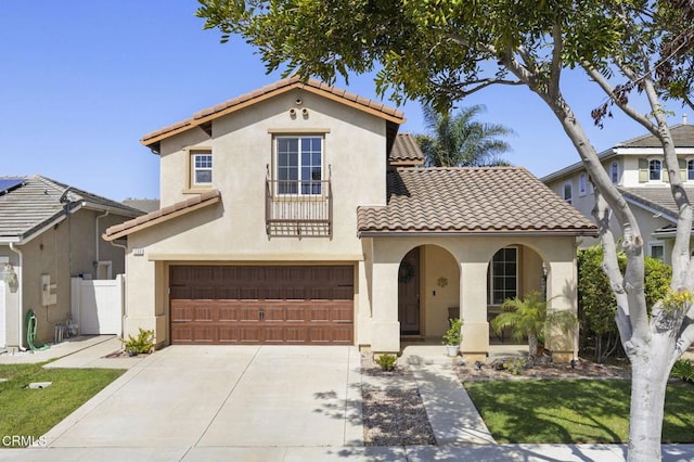 1269 Hacienda Dr, Oxnard, CA 93030 - mediterranean / spanish-style home with a garage, stucco siding, and a tiled roof