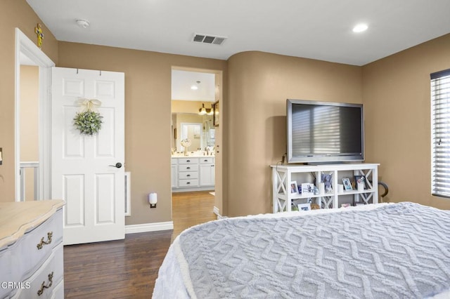 1269 Hacienda Dr, Oxnard, CA 93030 - bedroom featuring dark wood-style flooring, recessed lighting, baseboards, and ensuite bathroom