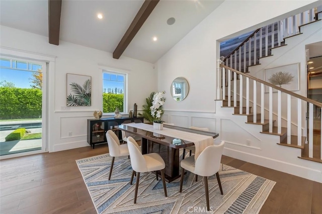 20701 Dumont St, Woodland Hills, CA 91364 - dining area featuring a decorative wall, plenty of natural light, stairs, wood finished floors, and wainscoting