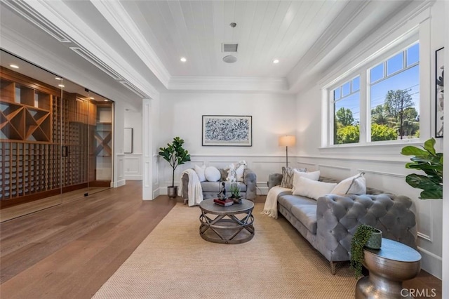 20701 Dumont St, Woodland Hills, CA 91364 - living room featuring wood finished floors, ornamental molding, a decorative wall, a tray ceiling, and recessed lighting