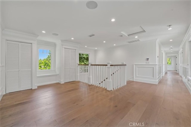 20701 Dumont St, Woodland Hills, CA 91364 - hallway featuring ornamental molding, light wood-type flooring, attic access, recessed lighting, and an upstairs landing