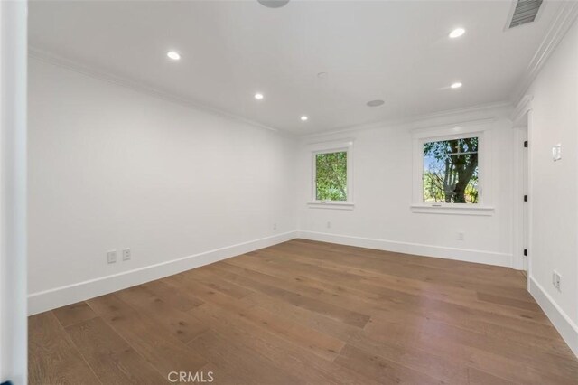 20701 Dumont St, Woodland Hills, CA 91364 - unfurnished room featuring crown molding, baseboards, recessed lighting, and wood finished floors