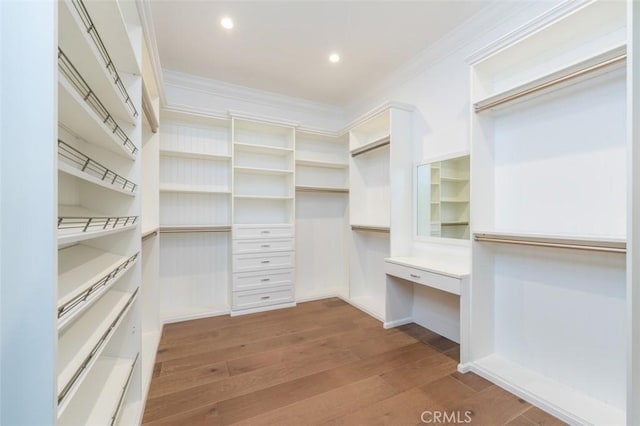 20701 Dumont St, Woodland Hills, CA 91364 - spacious closet with hardwood / wood-style flooring and built in desk