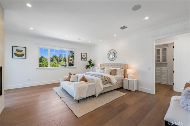 20701 Dumont St, Woodland Hills, CA 91364 - bedroom with crown molding, wood finished floors, baseboards, and recessed lighting