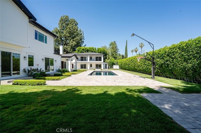 20701 Dumont St, Woodland Hills, CA 91364 - exterior space featuring a yard and a patio area