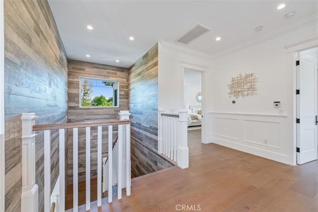 20701 Dumont St, Woodland Hills, CA 91364 - hallway with an upstairs landing, tile walls, recessed lighting, crown molding, and wood finished floors