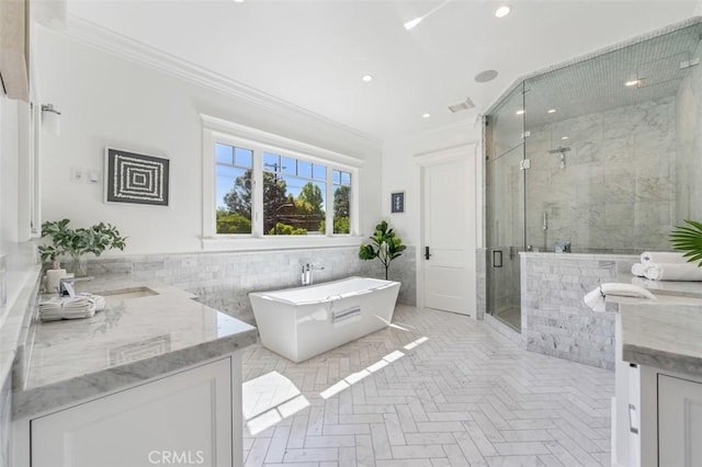 20701 Dumont St, Woodland Hills, CA 91364 - full bath with vanity, crown molding, a stall shower, a freestanding bath, and tile walls