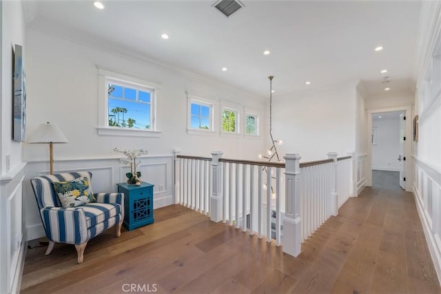 20701 Dumont St, Woodland Hills, CA 91364 - hallway featuring hardwood / wood-style floors, a decorative wall, recessed lighting, crown molding, and wainscoting