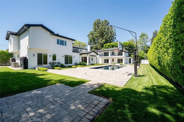 20701 Dumont St, Woodland Hills, CA 91364 - back of house with a patio area, a lawn, and central AC unit