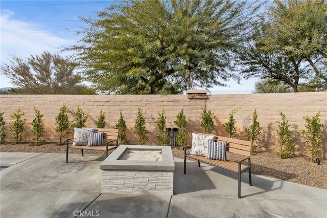 84020 Colibri Ct, Indio, CA 92203 - fenced backyard featuring an outdoor fire pit and a patio area