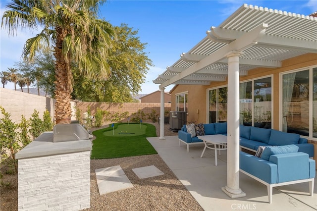84020 Colibri Ct, Indio, CA 92203 - fenced backyard featuring outdoor lounge area, an area to practice putting, a pergola, a patio area, and exterior kitchen