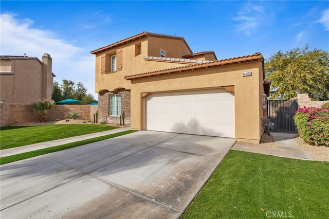 84020 Colibri Ct, Indio, CA 92203 - mediterranean / spanish home featuring concrete driveway, stucco siding, a gate, and a tile roof